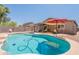 Enjoy the backyard with a private pool, perfect for swimming and relaxation in a resort-like setting at 21311 N Shelby Ct, Maricopa, AZ 85138