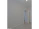 This bedroom features neutral walls, carpet floors, and an open closet at 2333 W Alta Vista Rd, Phoenix, AZ 85041
