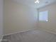 This bedroom features neutral walls, carpet floors, and a ceiling fan at 2333 W Alta Vista Rd, Phoenix, AZ 85041