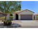 Charming single-story home with a tile roof, arched entryway, and a well-maintained front yard with mature landscaping at 2333 W Alta Vista Rd, Phoenix, AZ 85041