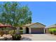 Charming home with a tile roof, desert landscaping, and mature shade tree at 2333 W Alta Vista Rd, Phoenix, AZ 85041