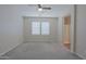 This main bedroom features neutral walls, carpet floors, and an attached bathroom at 2333 W Alta Vista Rd, Phoenix, AZ 85041