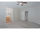 This main bedroom features neutral walls, carpet floors, and an attached bathroom at 2333 W Alta Vista Rd, Phoenix, AZ 85041