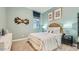 Inviting bedroom with a rattan headboard, a dresser, and soothing colors for a peaceful atmosphere at 2955 E Lucky Horseshoe Ln, San Tan Valley, AZ 85140