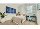 Charming bedroom with patterned wallpaper, a work space, and a neutral color palette for a calming vibe at 2955 E Lucky Horseshoe Ln, San Tan Valley, AZ 85140