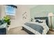 Cozy bedroom with nautical decor, a bright window, and comfortable furnishings for a relaxing retreat at 2955 E Lucky Horseshoe Ln, San Tan Valley, AZ 85140