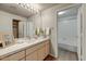 Modern bathroom featuring light wood cabinets, quartz countertop, and shower-tub combo at 29606 N Tatum N Blvd # 265, Cave Creek, AZ 85331