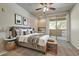Comfortable bedroom with a large bed, balcony access, and built-in storage at 29606 N Tatum N Blvd # 265, Cave Creek, AZ 85331