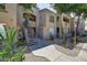 Apartment building exterior with stairway, landscaping, and pathway at 29606 N Tatum N Blvd # 265, Cave Creek, AZ 85331