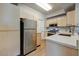 The kitchen features stainless steel appliances, light wood cabinets and countertops at 29606 N Tatum N Blvd # 265, Cave Creek, AZ 85331