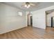 Open-concept living room featuring wood floors, archway and natural light at 29606 N Tatum N Blvd # 265, Cave Creek, AZ 85331
