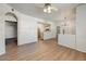 Inviting living room showcasing wood floors, arched doorways, and modern lighting fixtures at 29606 N Tatum N Blvd # 265, Cave Creek, AZ 85331