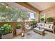 Cozy patio with outdoor seating, plants, and string lights for relaxing ambiance at 29606 N Tatum N Blvd # 265, Cave Creek, AZ 85331