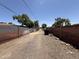 A view of the side yard between fences at 324 E Riviera Dr, Tempe, AZ 85282