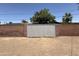 A block wall encloses an area in the backyard at 324 E Riviera Dr, Tempe, AZ 85282