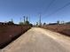 View of a backyard bordered by brick fencing at 324 E Riviera Dr, Tempe, AZ 85282
