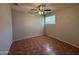 Comfortable bedroom with tile floors, a ceiling fan, and a window for natural light at 324 E Riviera Dr, Tempe, AZ 85282