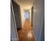 Long hallway with tile flooring leading to other rooms of the house at 324 E Riviera Dr, Tempe, AZ 85282