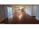 Spacious open floor plan connecting the kitchen and living areas with tile floors and bright lighting at 324 E Riviera Dr, Tempe, AZ 85282