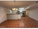 Open kitchen with tile flooring, stainless appliances, and recessed lighting at 324 E Riviera Dr, Tempe, AZ 85282