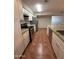 Updated kitchen with white cabinetry, granite countertops, and stainless steel appliances at 324 E Riviera Dr, Tempe, AZ 85282