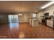 Open floor plan showcasing the kitchen and dining areas with stylish cabinets and flooring at 324 E Riviera Dr, Tempe, AZ 85282