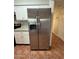 Kitchen featuring stainless steel refrigerator and ample cabinet space at 324 E Riviera Dr, Tempe, AZ 85282