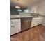 Bright kitchen featuring granite counters, stainless steel appliances, and white cabinetry at 324 E Riviera Dr, Tempe, AZ 85282