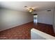 Open living room with tile floors and a ceiling fan, offering a bright and airy space at 324 E Riviera Dr, Tempe, AZ 85282