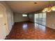 Open living area with tile flooring, patio access and modern light fixtures for a cozy atmosphere at 324 E Riviera Dr, Tempe, AZ 85282