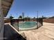 Fenced in pool area with well-maintained cement surrounding the pool at 324 E Riviera Dr, Tempe, AZ 85282