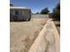Side yard with gravel ground cover and a block wall fence at 324 E Riviera Dr, Tempe, AZ 85282