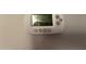 Close up of a white thermostat on the wall at 324 E Riviera Dr, Tempe, AZ 85282