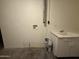 This utility room offers a sink and storage at 324 E Riviera Dr, Tempe, AZ 85282