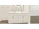 Modern bathroom features double vanity sinks and white cabinets at 3498 N Camden Dr, Florence, AZ 85132