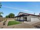 The backyard has a large patio cover with fresh rock and a small grass section for outdoor living at 3926 E Coconino St, Phoenix, AZ 85044