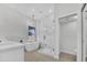 Stylish bathroom featuring soaking tub, glass enclosed shower, and marble accents at 3926 E Coconino St, Phoenix, AZ 85044