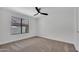 Bedroom features neutral carpet, a ceiling fan, and a window at 3926 E Coconino St, Phoenix, AZ 85044