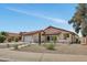 Charming single-story home with desert landscaping, a red tile roof, and a welcoming front entrance at 3926 E Coconino St, Phoenix, AZ 85044