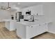 Beautiful kitchen featuring an island with seating, stainless steel appliances, and white cabinets at 3926 E Coconino St, Phoenix, AZ 85044