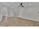 Spacious living room with vaulted ceilings and sleek ceiling fan at 3926 E Coconino St, Phoenix, AZ 85044