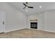Living room features wood-look flooring, a modern fireplace, neutral walls, and recessed lighting at 3926 E Coconino St, Phoenix, AZ 85044