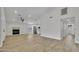 Expansive living space featuring sleek flooring, a modern fireplace, and seamless access to the kitchen at 3926 E Coconino St, Phoenix, AZ 85044