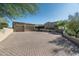 Stunning home with a spacious driveway, three-car garage, and lush desert landscaping at 40039 N 107Th Pl, Scottsdale, AZ 85262