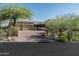 Beautiful home exterior showcasing a spacious driveway, garage, and desert landscaping at 40039 N 107Th Pl, Scottsdale, AZ 85262
