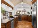 Well-appointed kitchen featuring custom cabinets, high-end appliances, and a seamless transition to the living spaces at 40039 N 107Th Pl, Scottsdale, AZ 85262