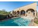 Beautiful backyard pool, covered patio, and desert landscaping offer a perfect retreat at 40039 N 107Th Pl, Scottsdale, AZ 85262