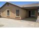 Exterior of the home features a covered patio and landscaped yard at 46129 W Barbara Ln, Maricopa, AZ 85139