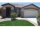 Charming single-story home featuring a well-manicured lawn and a neutral color scheme at 46129 W Barbara Ln, Maricopa, AZ 85139