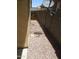 View of a side yard featuring decorative rocks and a satellite dish at 46129 W Barbara Ln, Maricopa, AZ 85139